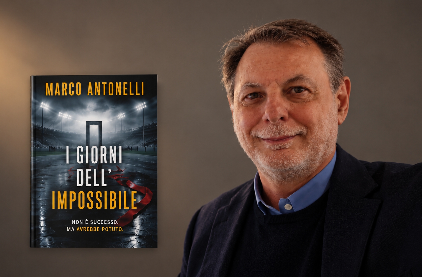 Marco Antonelli accanto alla copertina di I giorni dell’impossibile.
